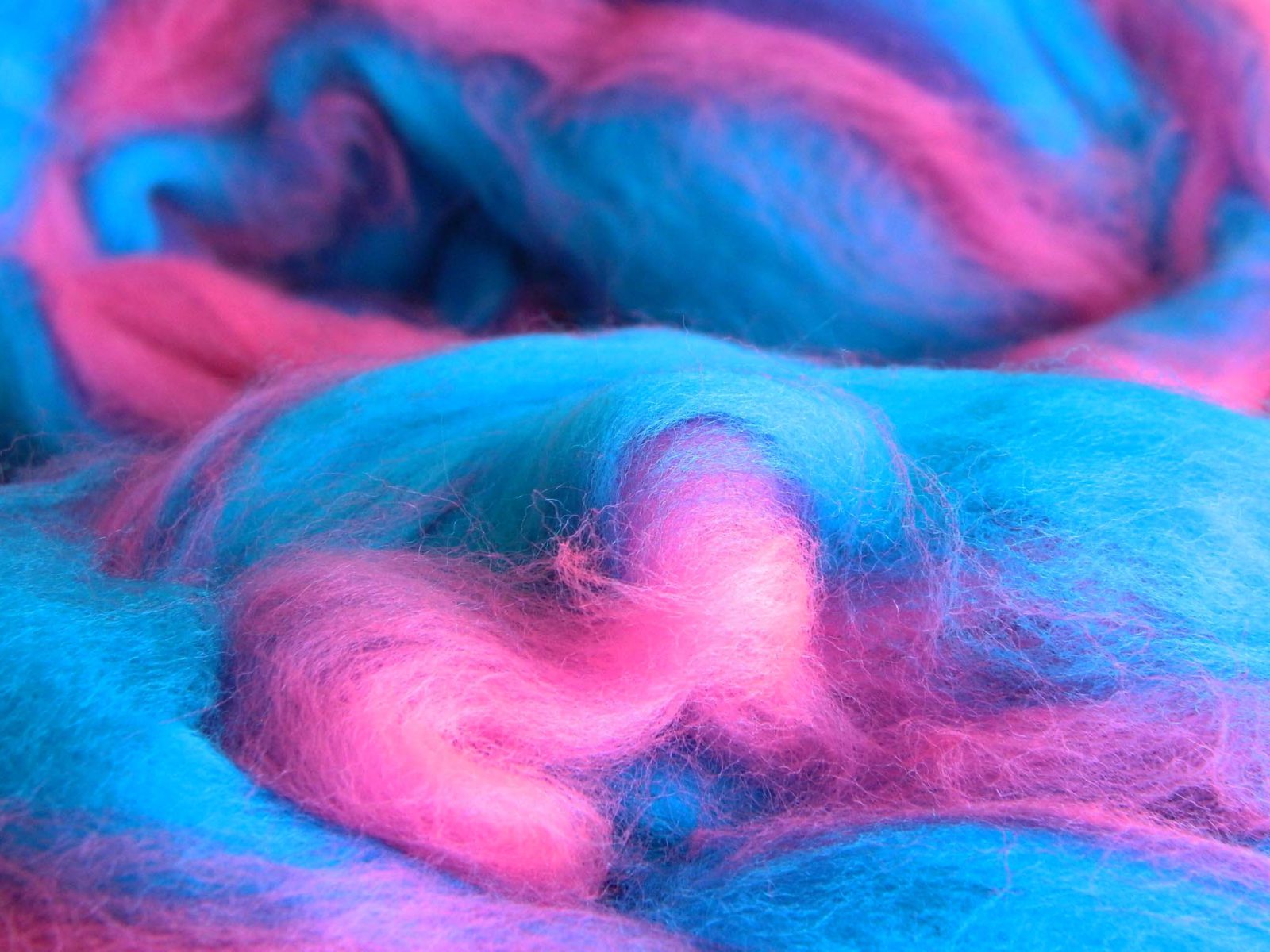 Large fluffy pile of blue and pink cotton candy
