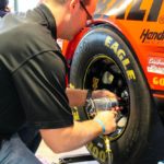 bolting a tire on