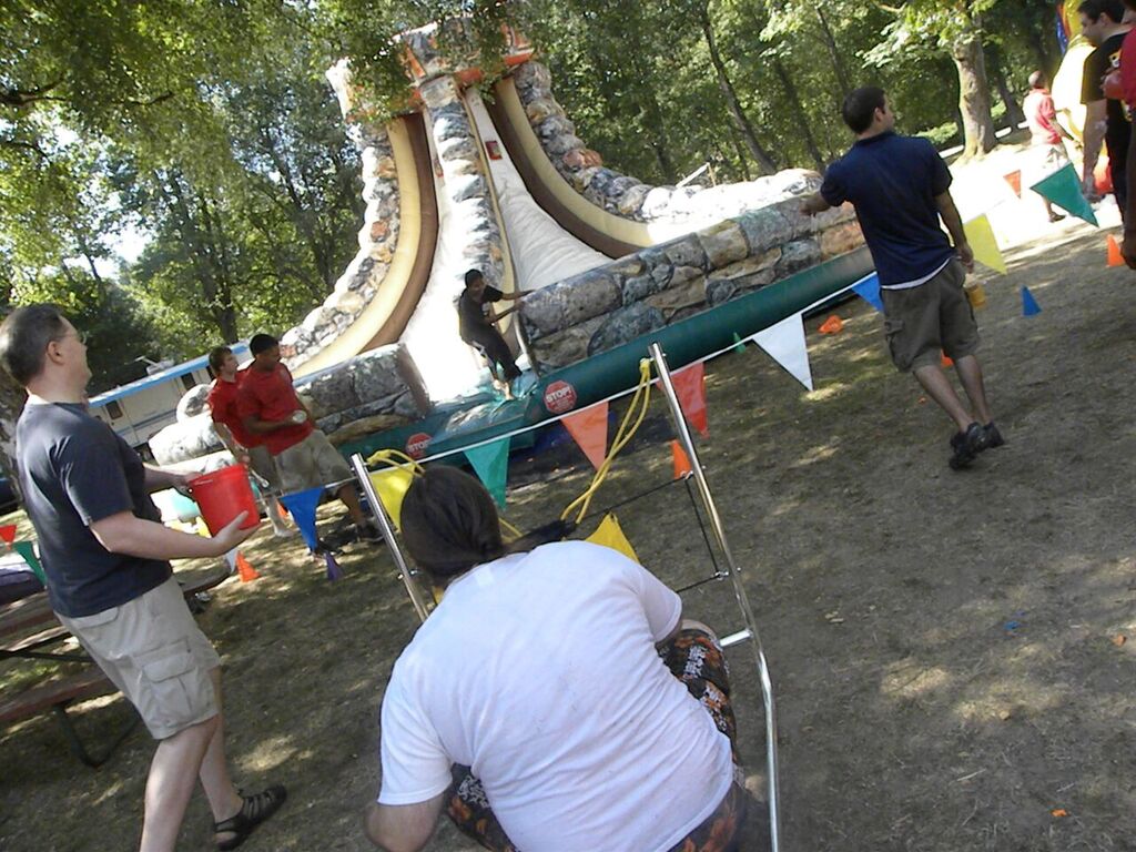 water balloon launcher and warped wall challenge at a summer company picnic