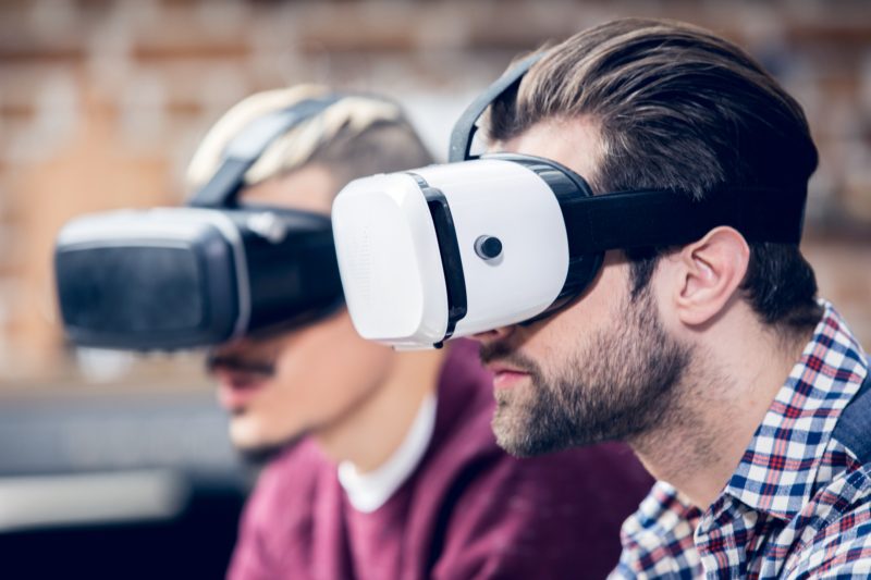 Men wearing virtual reality headsets