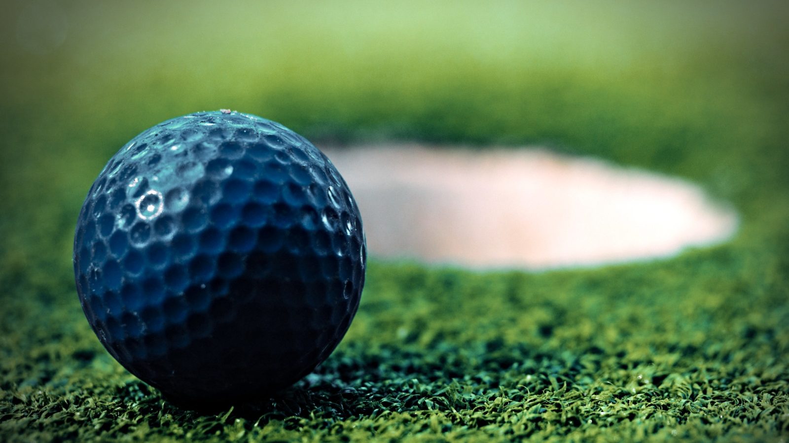 mini golf ball and hole