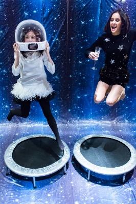 jumping on trampolines in a stargazing room