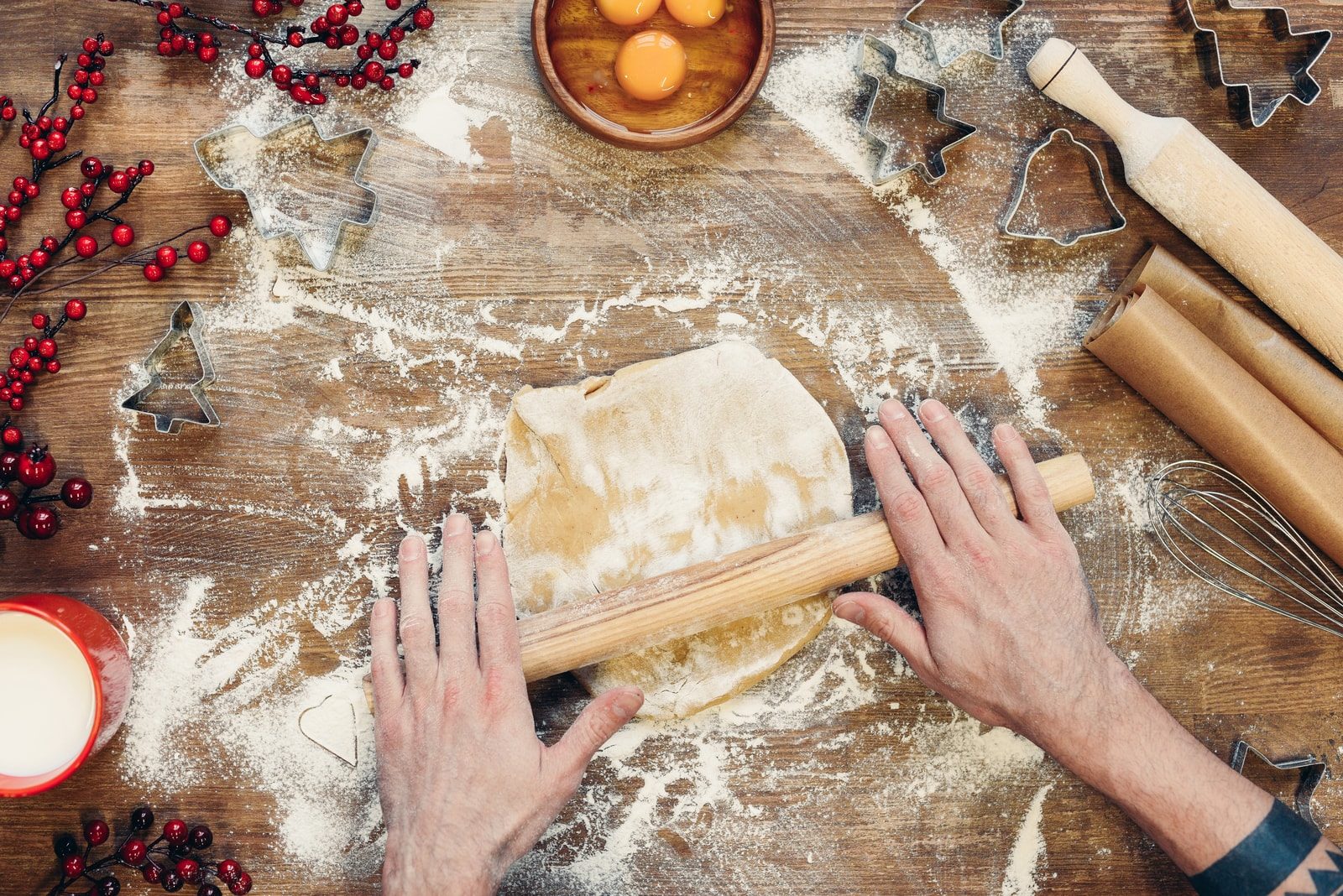 Baker rolling dough 