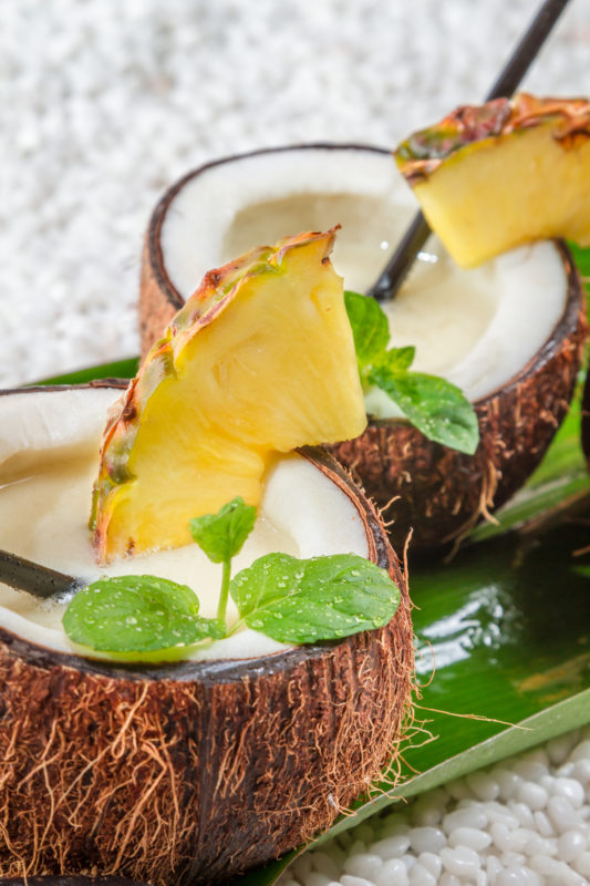 Closeup of pinacolada in a coconut