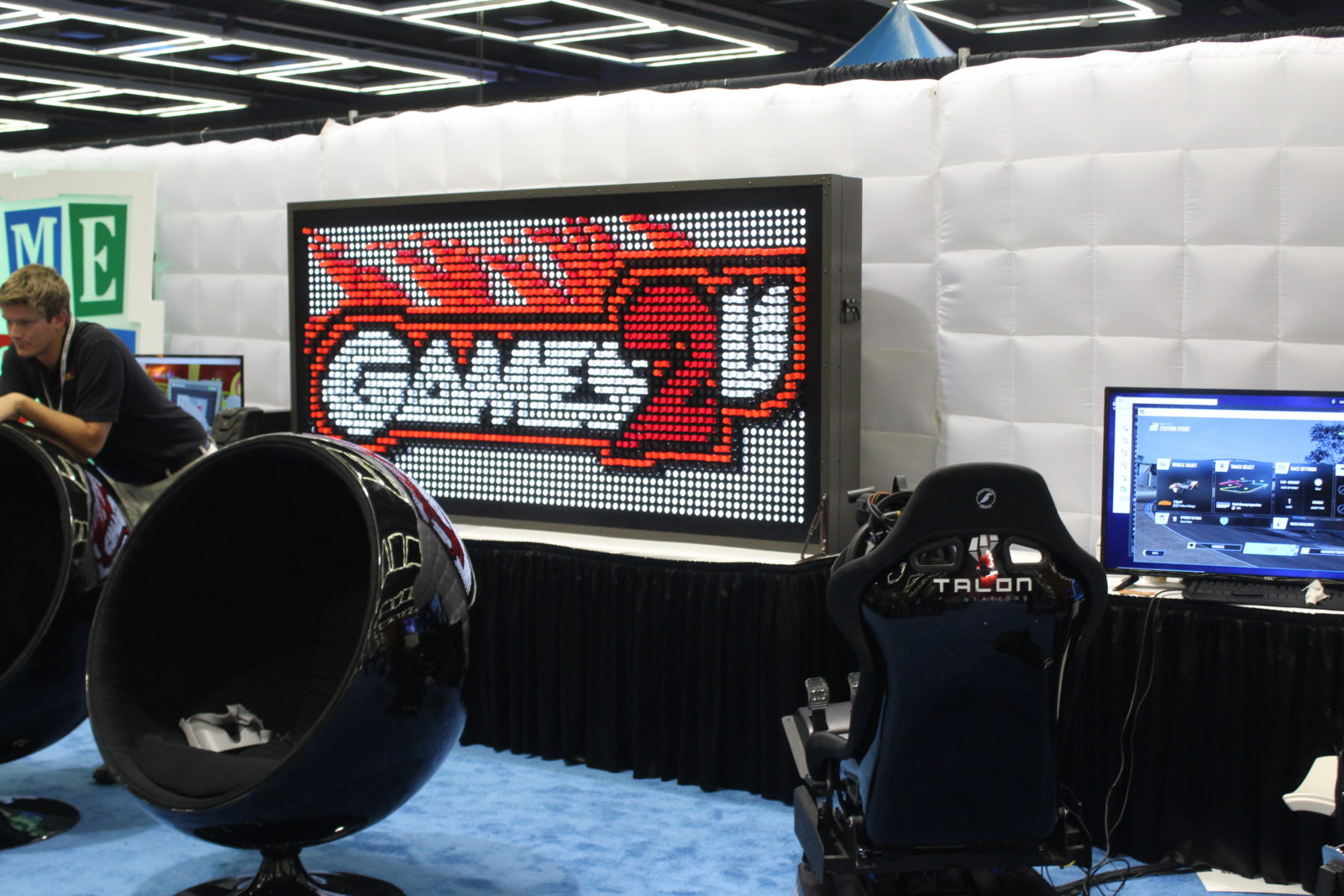 giant Lite-Brite sign and virtual reality gaming chairs