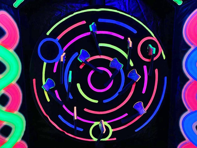 Glow in the dark Axe Throwing game National Event Pros